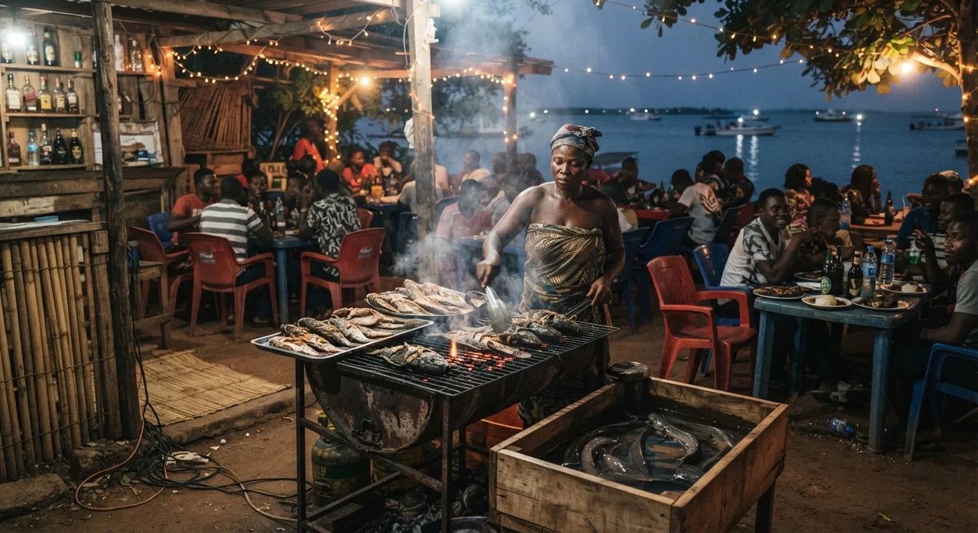 A busy Ghanaian point-and-kill bar at dusk, a vendor grilling fresh live African catfish over coals, customers seated at plastic tables, warm string lights, documentary night scene